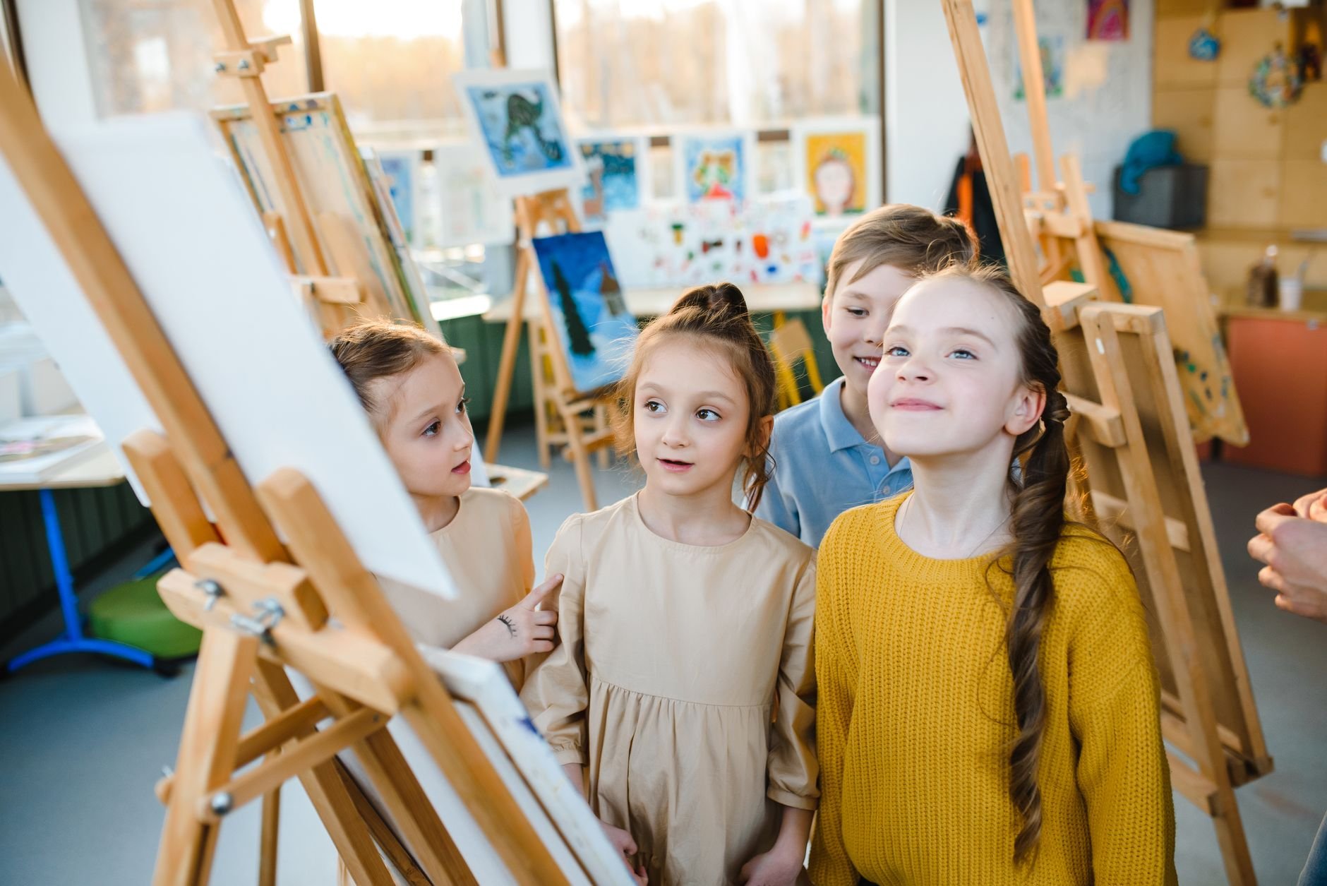 A group of children in an enthusiastic creative class, full of energy and expression.